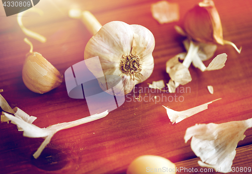 Image of close up of garlic on wooden table