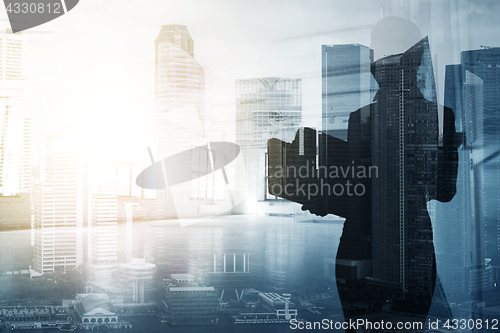 Image of businesswoman or secretary over city background