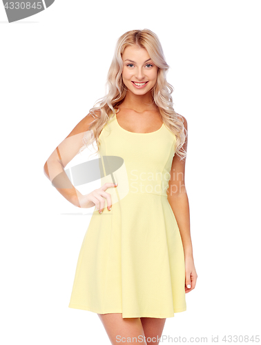 Image of happy smiling beautiful young woman in dress