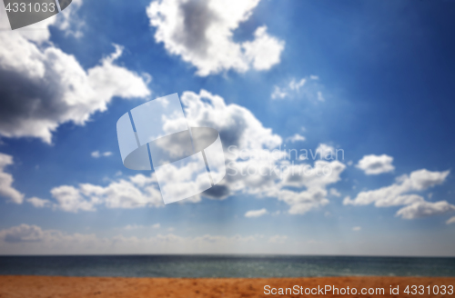 Image of Blurred sea beach in sun summer day