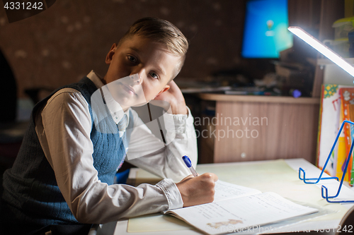 Image of pupil boy does his homework