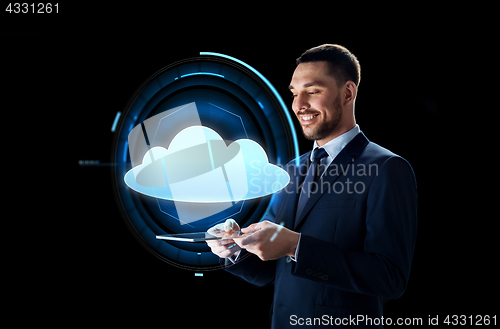 Image of businessman with tablet pc and cloud projection