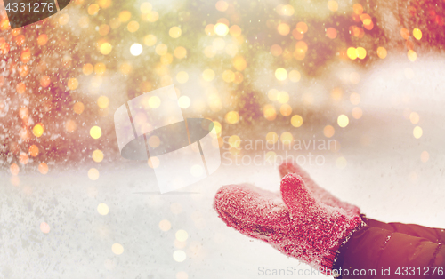 Image of close up of woman throwing snow outdoors
