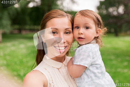 Image of mother with baby girl taking selfie at summer park