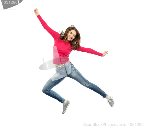 Image of smiling young woman jumping in air