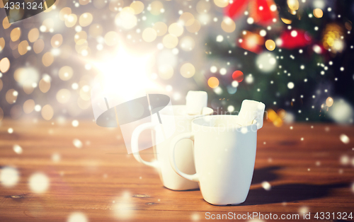 Image of cups of hot chocolate with marshmallow on wood