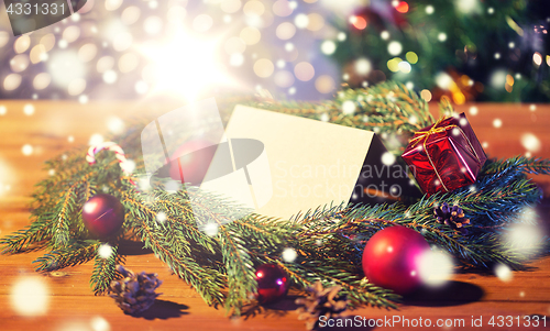 Image of natural green fir wreath with note on wooden board