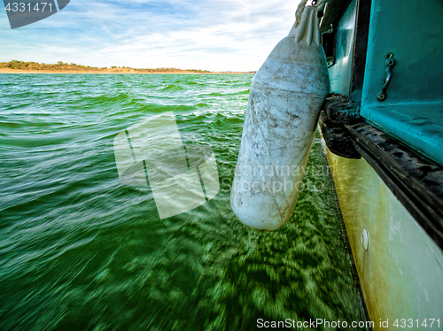 Image of View of Green Ocean Waves from Boat Board