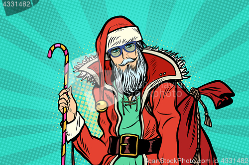 Image of Hipster Santa Claus with sweets and Christmas gift