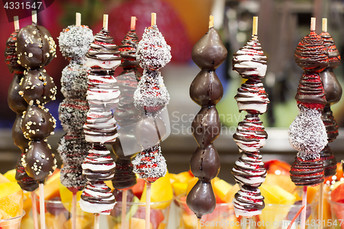Image of Chocolate dipped strawberries on market in Barcelona