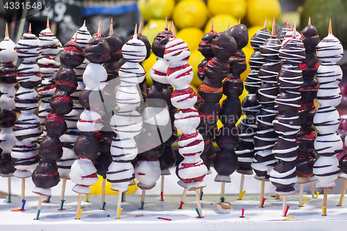 Image of Chocolate dipped strawberries on market in Barcelona