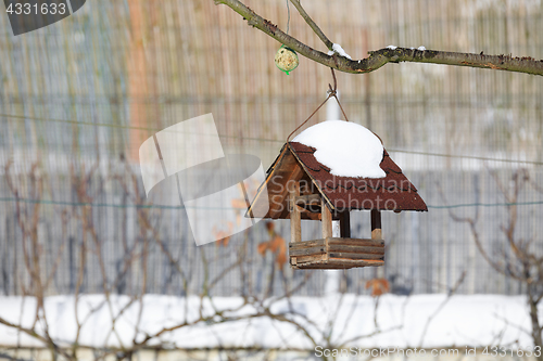 Image of birdhouse in winter garden