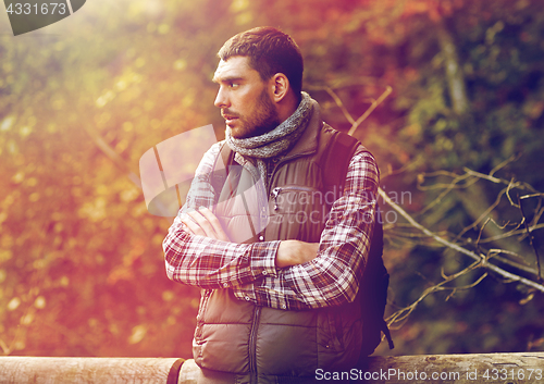 Image of man with backpack outdoors