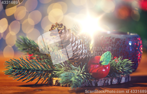 Image of christmas fir branch decoration and candle lantern