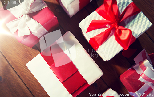 Image of close up of gift boxes on wooden floor from top