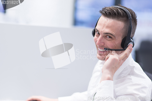 Image of male call centre operator doing his job