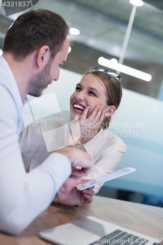 Image of Business People Working With Tablet in startup office