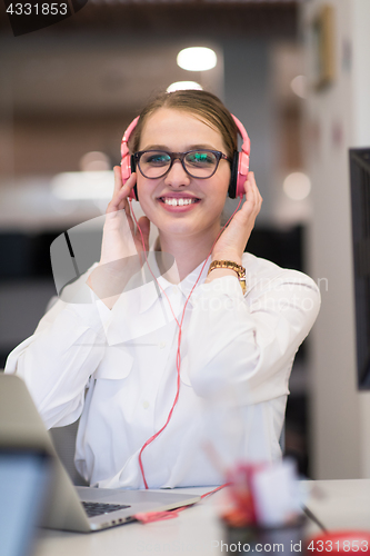 Image of businesswoman using a laptop in startup office