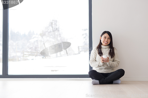 Image of asian woman enjoying morning coffee