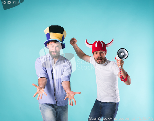 Image of Two Excited Male Friends Celebrate Watching Sports