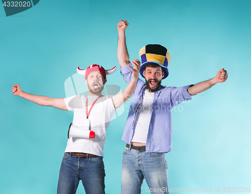 Image of Two Excited Male Friends Celebrate Watching Sports