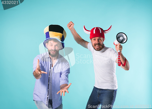 Image of Two Excited Male Friends Celebrate Watching Sports