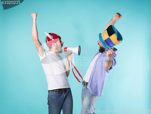 Image of Two Excited Male Friends Celebrate Watching Sports