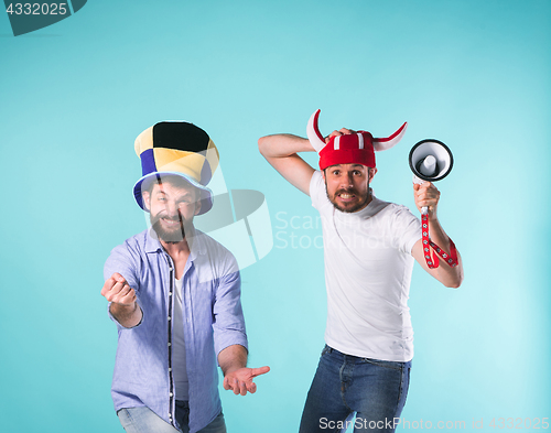 Image of Two Excited Male Friends Celebrate Watching Sports
