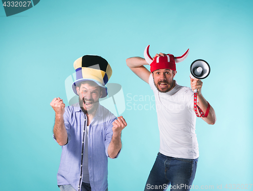 Image of Two Excited Male Friends Celebrate Watching Sports