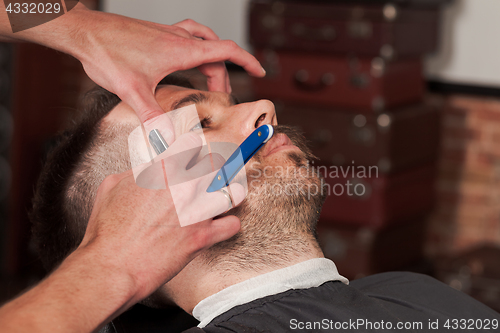 Image of Hipster client visiting barber shop