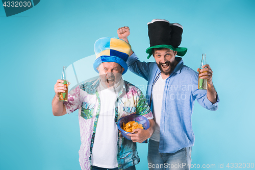 Image of The two football fans over blue