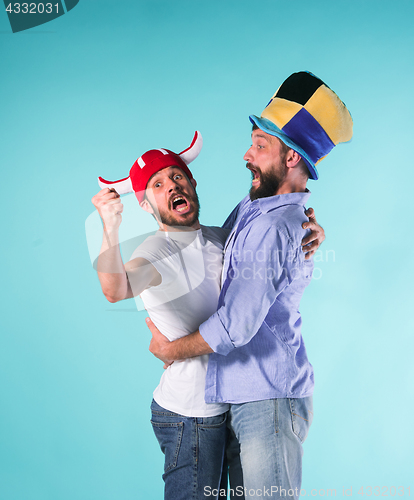 Image of Two Excited Male Friends Celebrate Watching Sports
