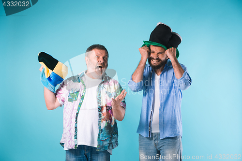 Image of The two football fans over blue