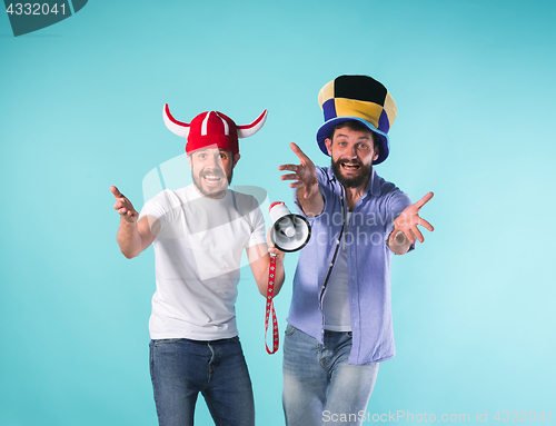 Image of Two Excited Male Friends Celebrate Watching Sports