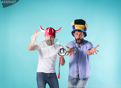 Image of Two Excited Male Friends Celebrate Watching Sports
