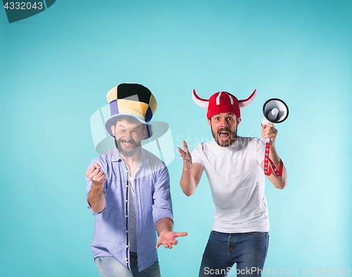 Image of Two Excited Male Friends Celebrate Watching Sports