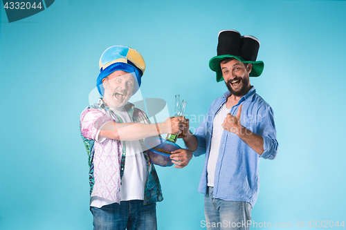 Image of The two football fans over blue