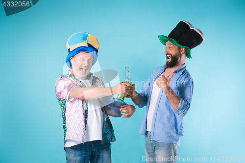 Image of The two football fans over blue