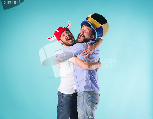 Image of Two Excited Male Friends Celebrate Watching Sports