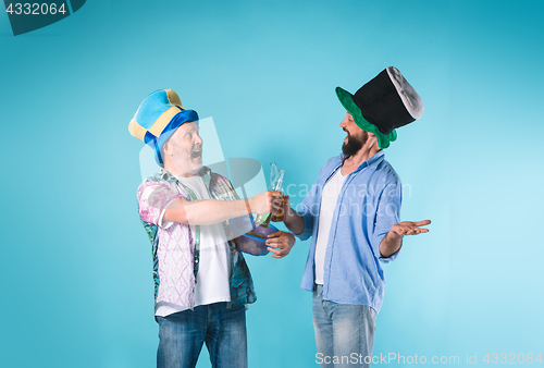 Image of The two football fans over blue