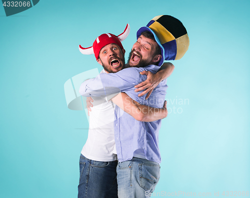 Image of Two Excited Male Friends Celebrate Watching Sports