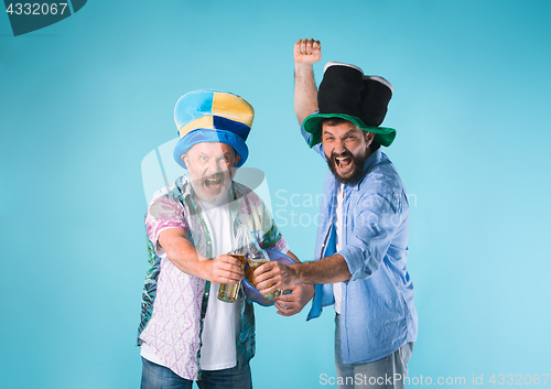 Image of The two football fans over blue
