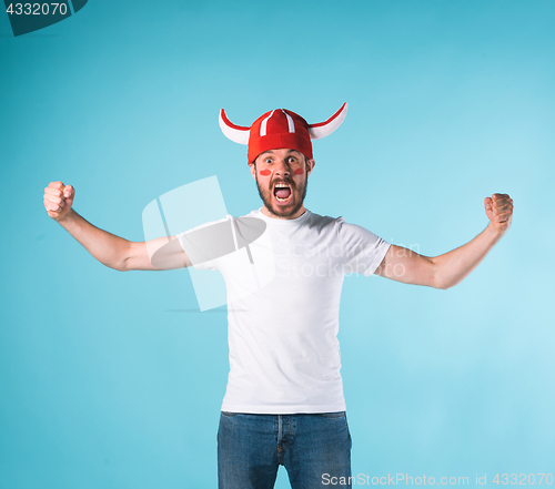 Image of The football fan over blue