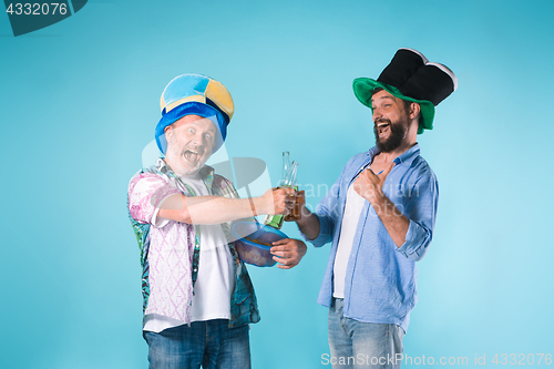 Image of The two football fans over blue