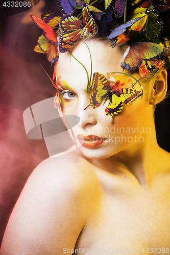 Image of woman with summer creative make up like fairy butterfly closeup 