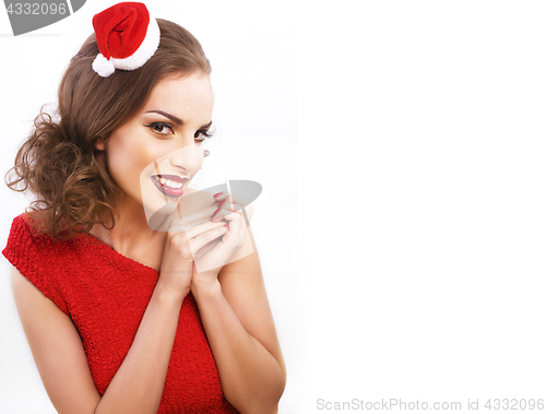 Image of young pretty brunette woman in christmas red hat isolated