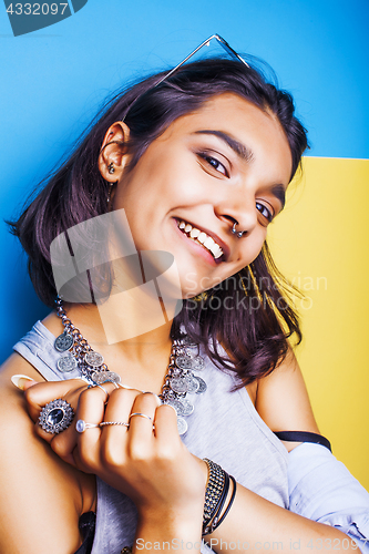Image of lifestyle people concept. young pretty smiling indian girl with long nails wearing lot of jewelry rings, asian summer happy cool