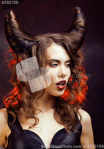 Image of bright mysterious woman with horn hair, halloween celebration