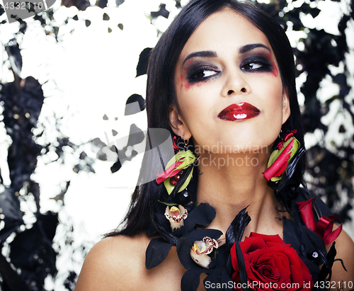 Image of pretty brunette woman with rose jewelry, black and red, bright m