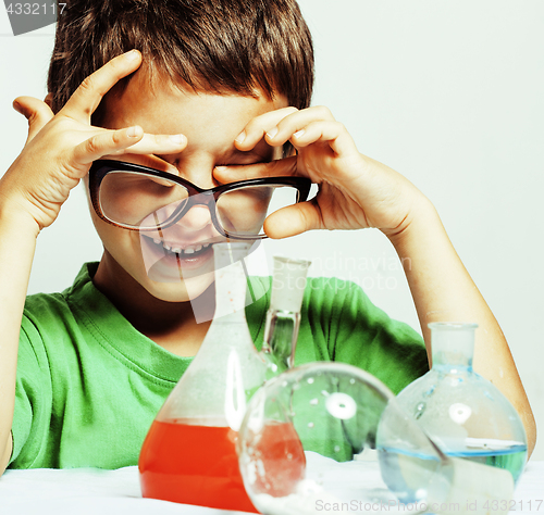 Image of little cute boy with medicine glass isolated